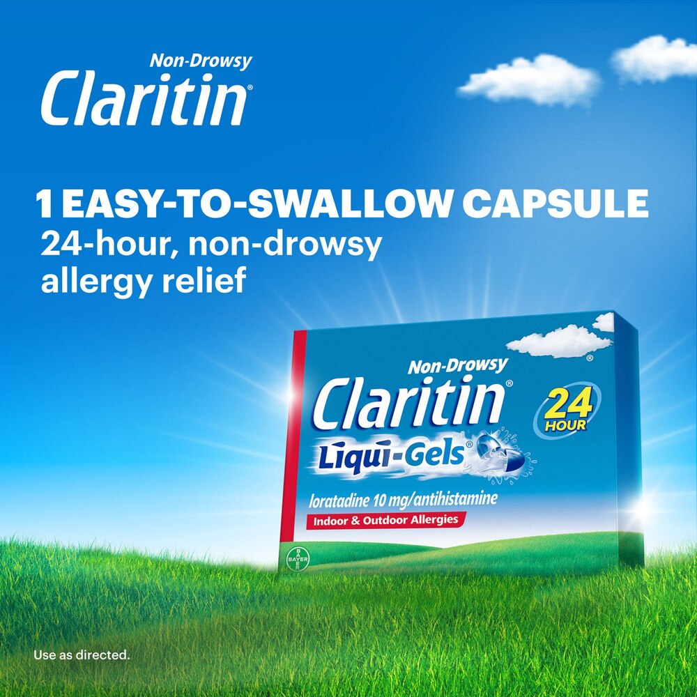 Claritin Liqui-Gels packaging with a blue sky and green grass background