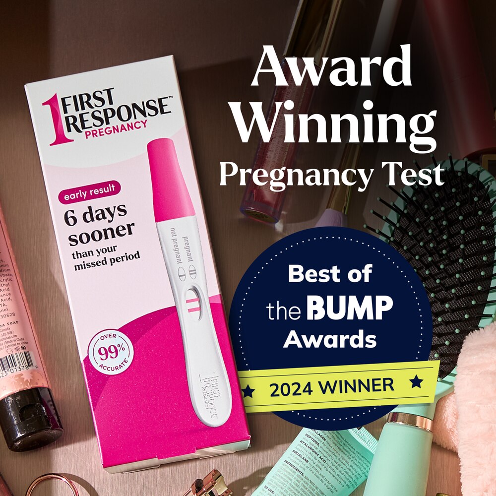 First Response pregnancy test with 'Best of the Bump Awards' 2024 winner badge on a wooden surface.