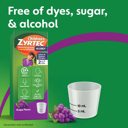Children's Zyrtec allergy medication packaging with a measuring cup and grapes on a green background