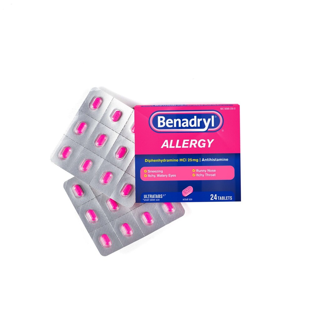Benadryl allergy medication packaging with pink tablets on a white background