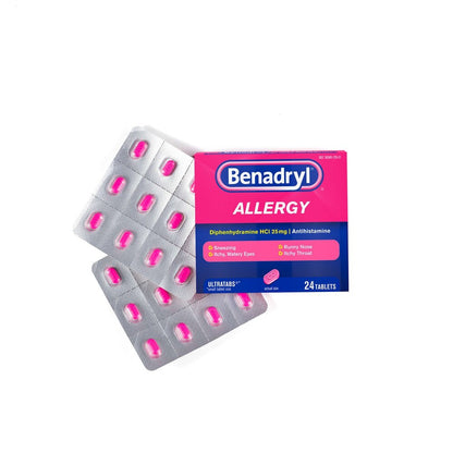 Benadryl allergy medication packaging with pink tablets on a white background
