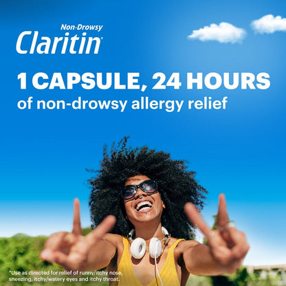Woman with sunglasses and headphones against a blue sky, promoting Claritin allergy relief.