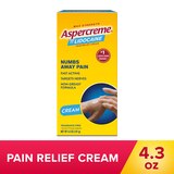 Box of Aspercreme Maximum Strength Pain Relief Cream with a hand holding a bottle on a red background