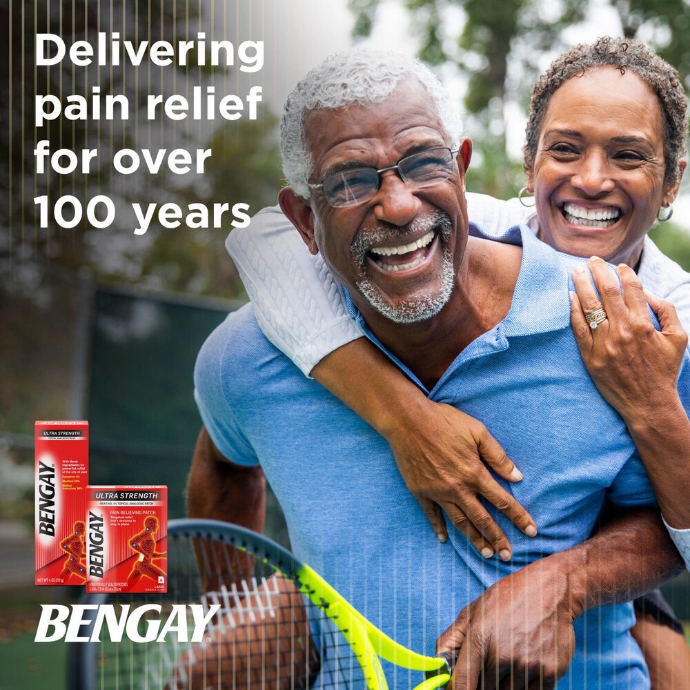 Man hugging a woman with Bengay pain reliever packaging and text about 100 years of pain relief.