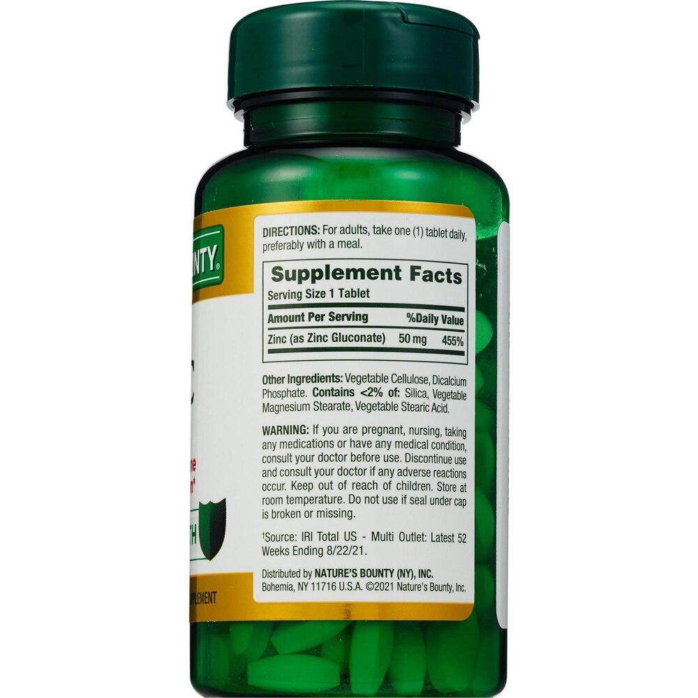 Green supplement bottle with label on a white background
