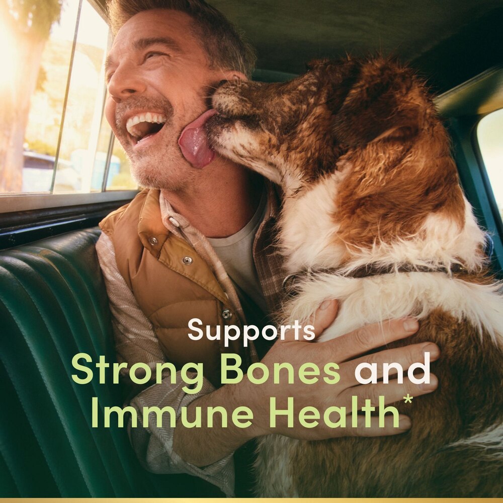 Man hugging a dog in a car with text about bone and immune health support.